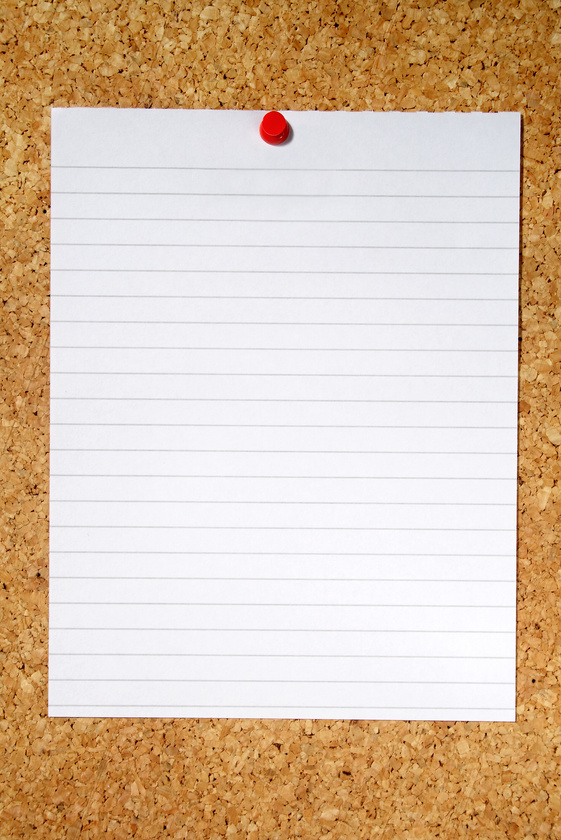 White Lined Paper Pinned to a Cork Notice Board.